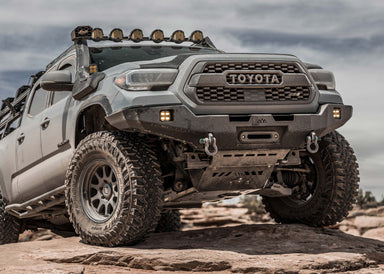 Front view of a 3rd gen Tacoma with a Backwoods Adventure Mods front bumper