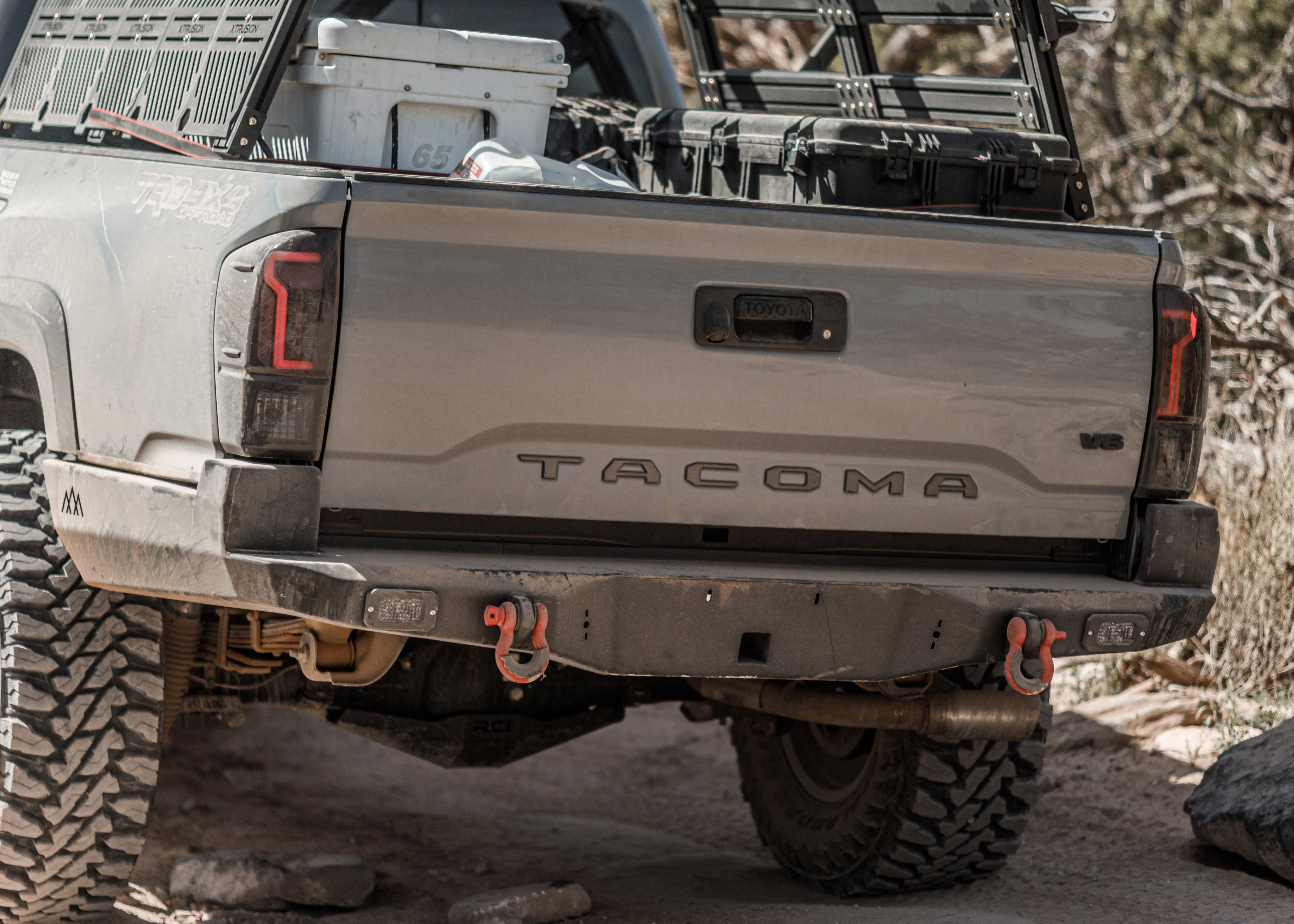 Grey Tacoma witha Backwoods Adventure Mods high clearance rear bumper