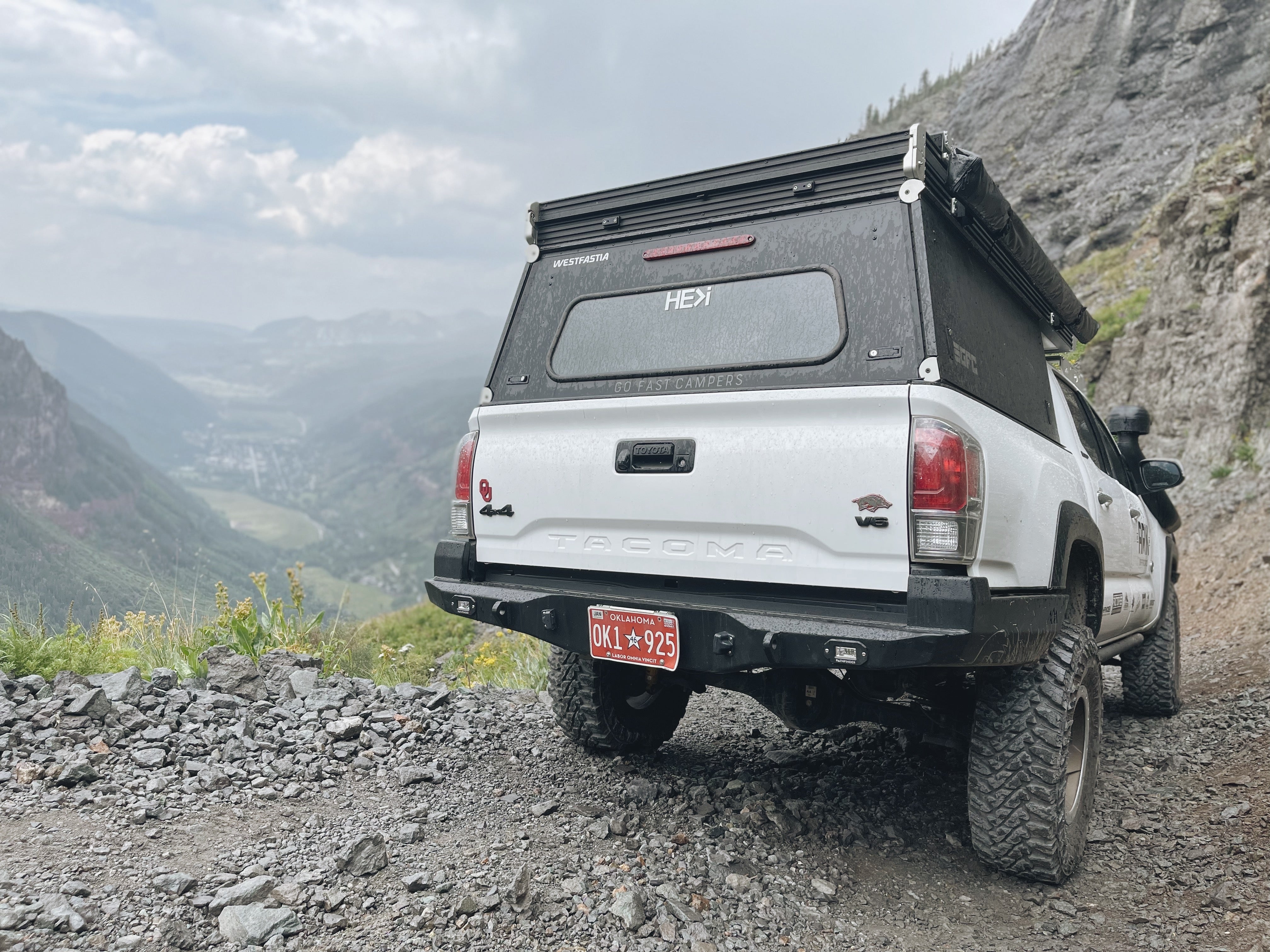 White 3rd gen Tacoma with Backwoods Adventure Mods high clearance rear bumper