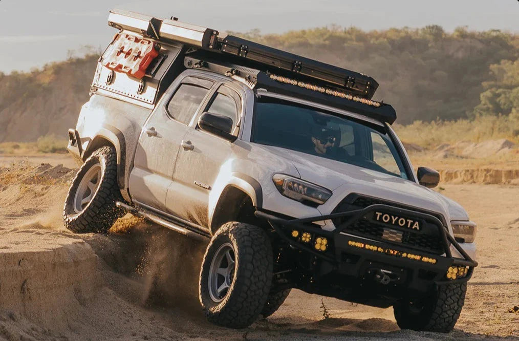 White 3rd Gen Tacoma off road in the sand