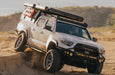 White 3rd Gen Tacoma off road in the sand