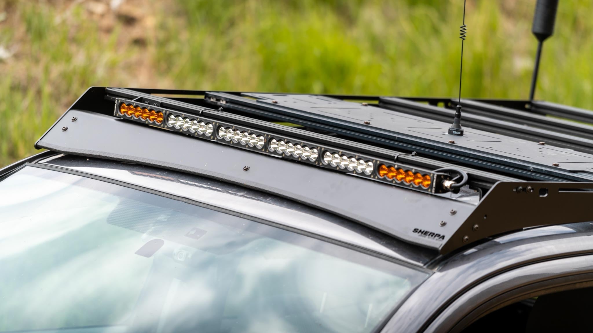 A full width light bar on a Sherpa Grand Teton Sport roof rack