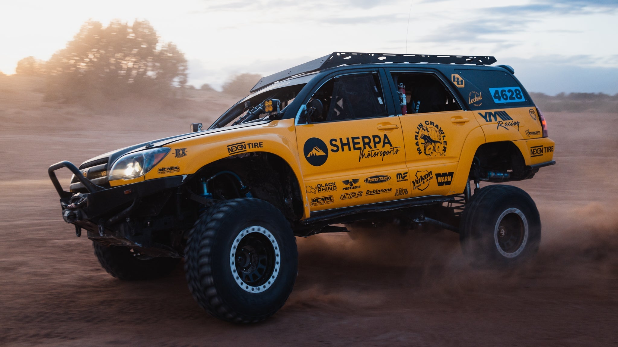 A 4th gen 4Runner racing with a Sherpa Princeton roof rack