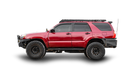 A red 4th gen 4Runner with a Sherpa Princeton roof rack and white background